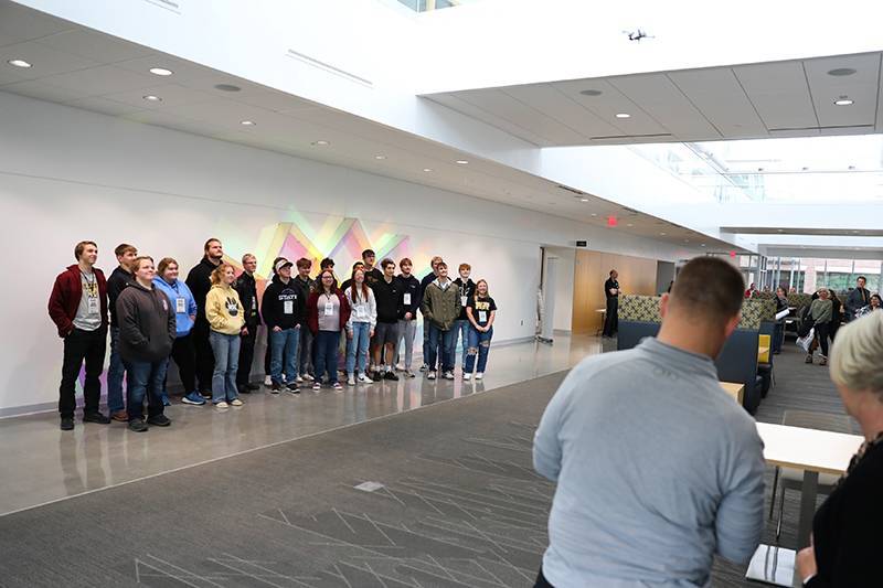 A drone takes a picture of a group of students at BST Gold Start on March 22