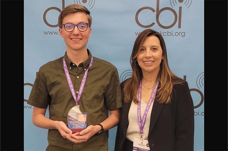 Photo of Grant Ferrell (left) with his fourth place award for Best Feature News Reporting