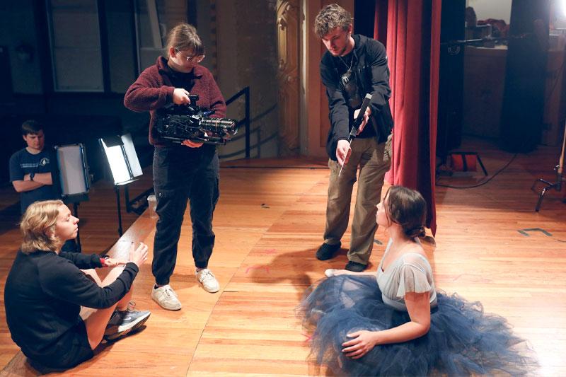 Students work on a film set at WSC