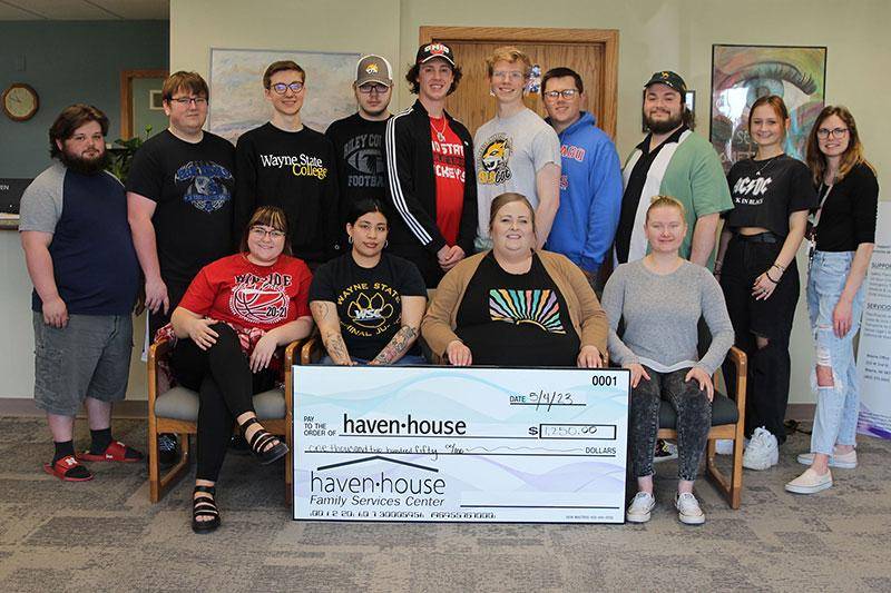 Photo of WSC broadcasting students with funding check to Haven House
