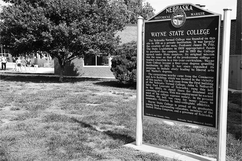 Photo of a historical marker on Wayne State College's campus