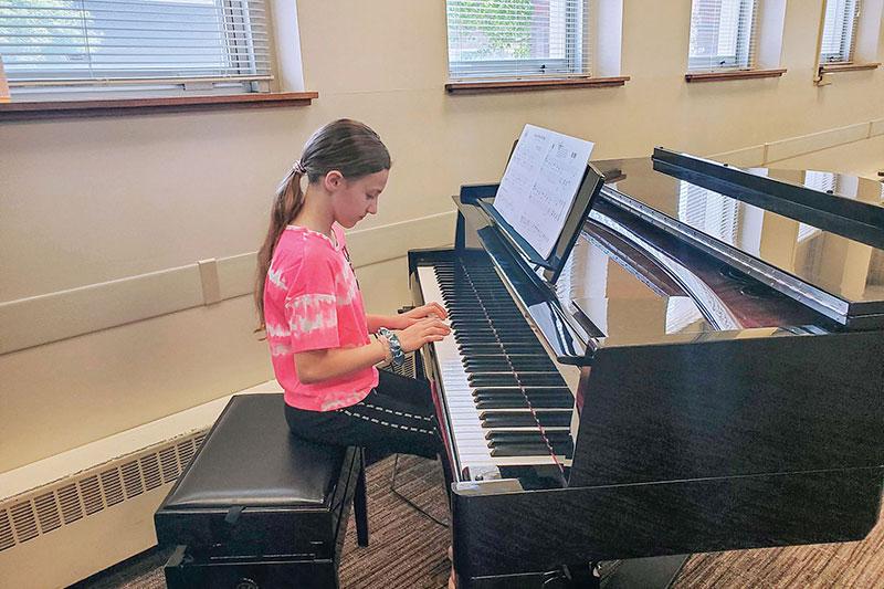 A child plays piano