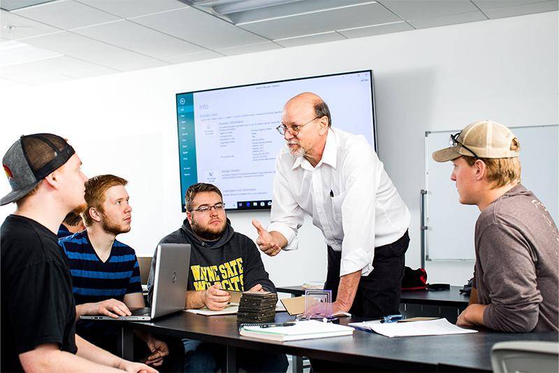 Faculty member Dr. Jeff Allen teaches students in an industrial technology classroom