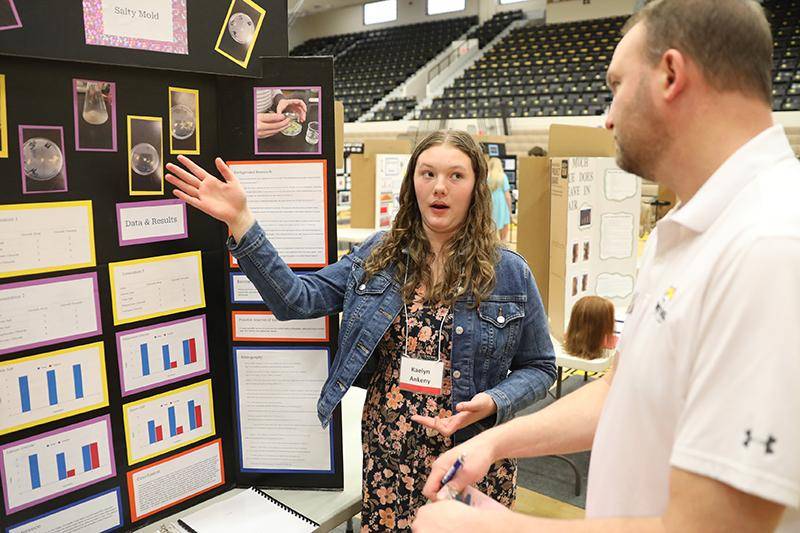 A student presents her project at the 2025 Nebraska Northeast Regional Science Fair.