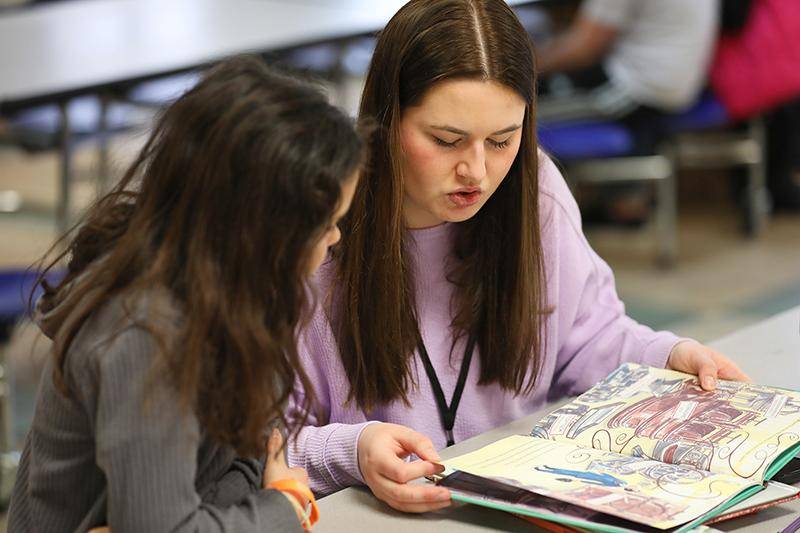 A WSC student participates in a service-learning project with an elementary student