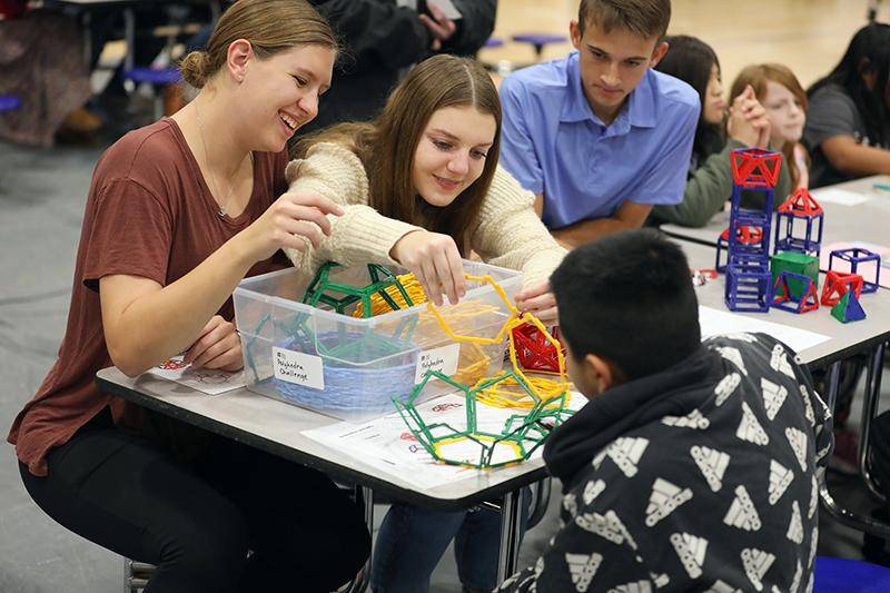 WSC students work with elementary students during Family Math, Science, and Art Night