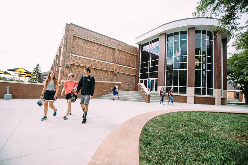 Students walk near the library on WSC's campus