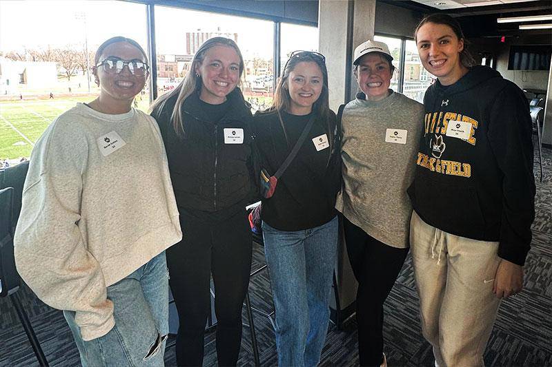Former track/cross country alumni at the March 2026 reunion