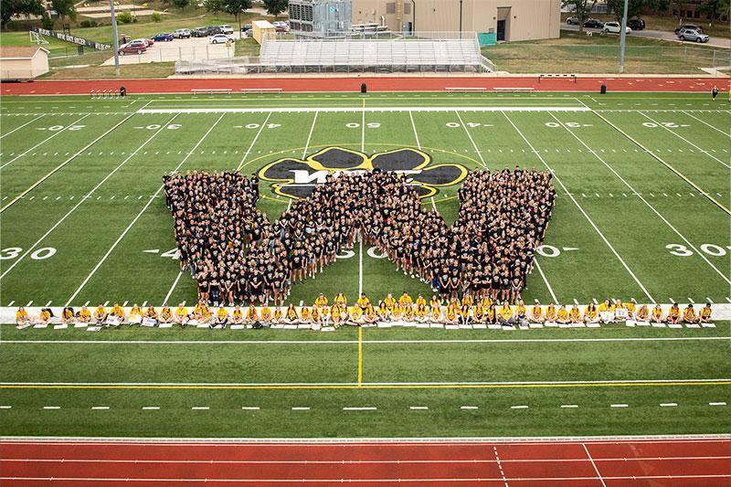 Class of 2025 in the form of a W on the football field