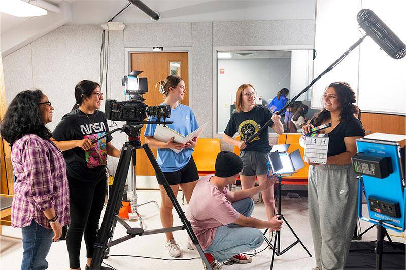 Photo of students working on films in the WSC film studio
