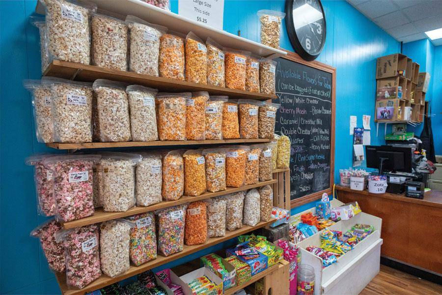 A display wall of gourmet popcorn at AquaPop in downtown Wayne