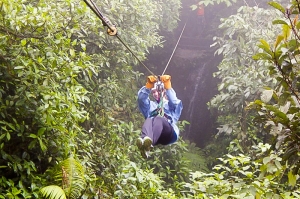 A student ziplines in Costa Rica
