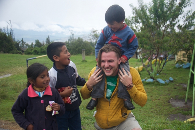 A Wayne State student plays with children of the Achuar tribe